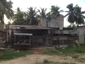 This shack is directly across the highway from a fancy new, all-glass building